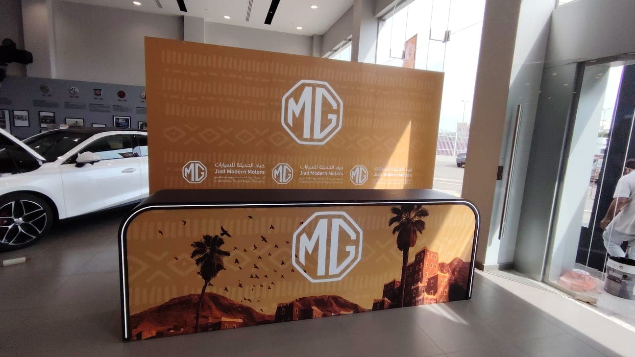 Team planning an exhibition booth in Saudi office